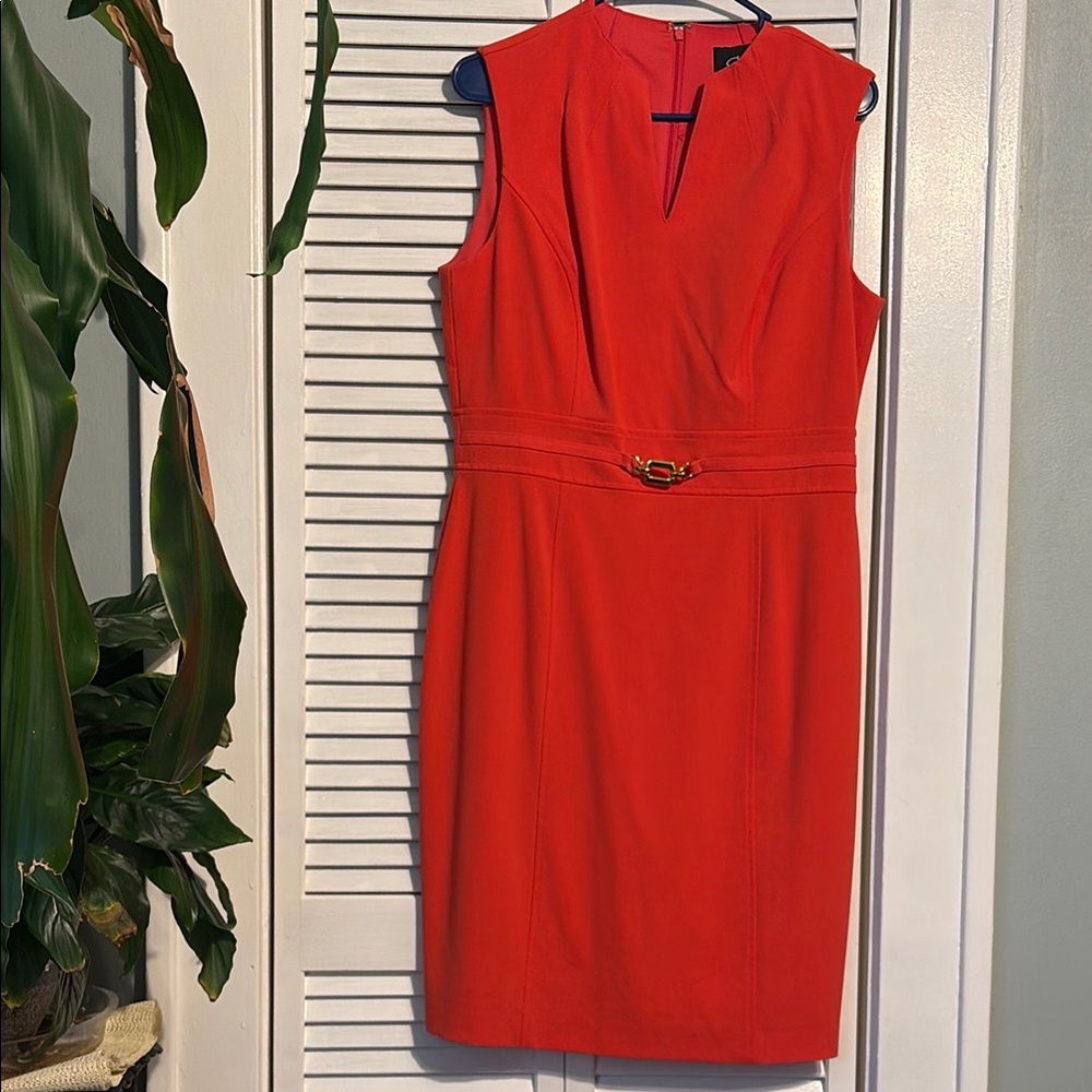 Red knee-length sheath dress with sleeveless design and V-neck for work